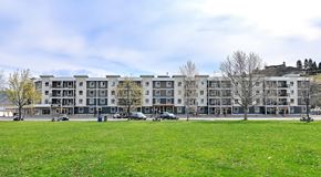 Summerland apartment for rent - A large apartment complex sits across the street from a green space
