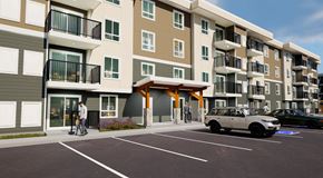 Saskatoon apartment for rent - An apartment building with parking in front, balconies and lots of windows