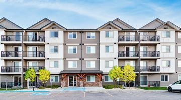 Edmonton apartment for rent - Apartment building with a pool in front.