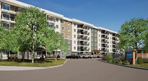 Ottawa apartment for rent - A large apartment complex with a parking lot in front.