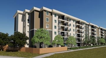 Ottawa apartment for rent - A modern apartment building with balconies and trees in front.