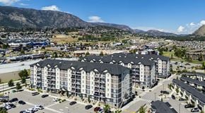 West Kelowna townhouse for rent - A large apartment complex with parking around all buildings