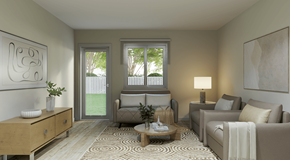 Fernie townhouse for rent - A living room with a sofa, armchair, and coffee table.