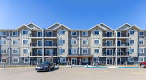Red Deer apartment for rent - A large apartment building with parking lot in front