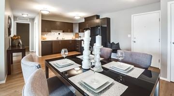 Edmonton apartment for rent - A modern dining room with a black table set for two.