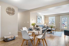 Cranbrook apartment for rent - A dining room with a table set for two and a dog bed.