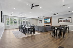 St. Louis townhouse for rent - A modern dining room with a long table and chairs.