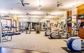 Hanover apartment for rent - A spacious gym with a variety of equipment including treadmills, stationary bikes, and weight machines.