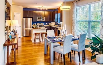 Hanover townhouse for rent - A modern kitchen with a dining table set for four.