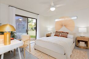 Mesa apartment for rent - a bedroom with a bed and a desk with a chair