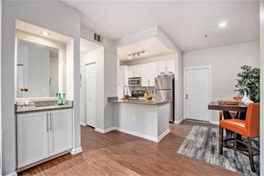 Glendale apartment for rent - A kitchen with white cabinets and a wooden floor.
