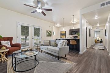 Meridian apartment for rent - a living room with a couch and a ceiling fan