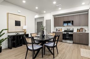 Saratoga Springs townhouse for rent - a kitchen and dining room with a table and chairs