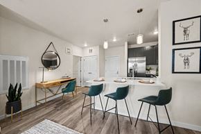 Colorado Springs apartment for rent - A dining room with a white table and chairs.