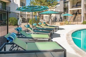 Ithaca apartment for rent - a kitchen and dining room with white cabinets and stainless steel appliances