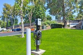 Escondido apartment for rent - an electric vehicle charging station on the grass in a parking lot