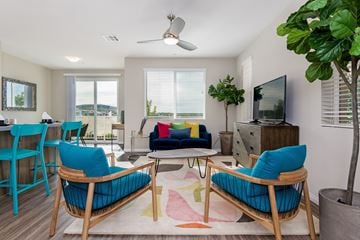 Chula Vista apartment for rent - A living room with blue chairs and a wooden coffee table.