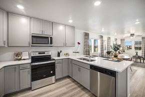Erie apartment for rent - Kitchen with stainless steel appliances and quartz counter tops