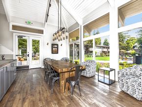 Santa Cruz apartment for rent - Lounge with view of grounds, communal wood table, metal chairs, cooking counter, hip lighting, armchairs