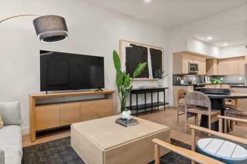 Los Angeles apartment for rent - A living room with a television and a dining area.