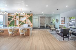 Tigard apartment for rent - A modern office space with wooden floors and furniture.