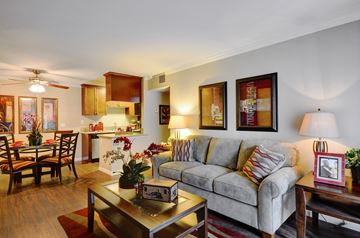La Mesa apartment for rent - A living room with a grey couch and a coffee table.