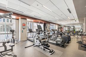 Denver apartment for rent - A gym with a variety of exercise equipment including treadmills, stationary bikes, and weight machines. at 1600 Glenarm Place, Denver, CO