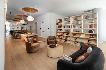 Nashville apartment for rent - A living room with a bookshelf and a couch.