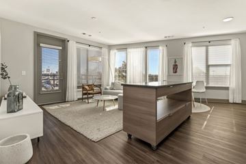 Washington apartment for rent - a living room with a desk and a rug