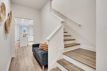 Collierville apartment for rent - A living room with a couch and a staircase.