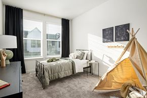 Saratoga Springs townhouse for rent - a bedroom with a bed and a tent in the corner