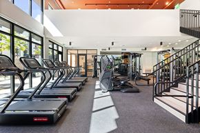 Los Angeles apartment for rent - A gym with treadmills and a staircase.