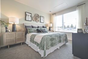 University Place apartment for rent - a bedroom with a bed and a large window