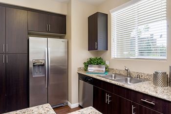 Side-by-side stainless steel refrigerator with water and ice maker