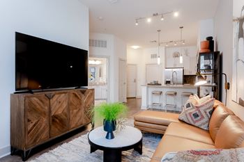 Wood-style flooring in entry, kitchen, living and dining areas