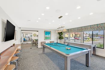 Game room featuring pool table, shuffleboard, and retro arcade game
