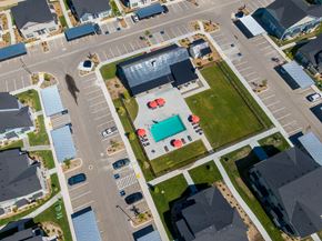 Eagle townhouse for rent - a building with a pool in the middle of a parking lot
