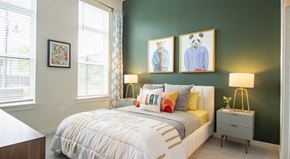 Atlanta apartment for rent - a bedroom with a bed and two paintings on the wall