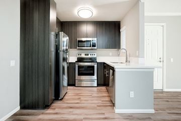 La Mesa apartment for rent - a kitchen with stainless steel appliances and a white counter top