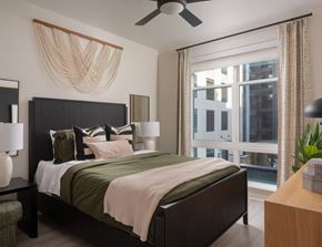 Ashburn apartment for rent - A bedroom with a large bed and a ceiling fan.