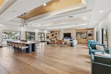 Scottsdale townhouse for rent - A spacious living room with a dining table and chairs.