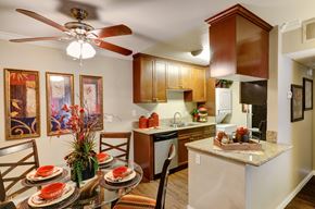 La Mesa apartment for rent - A kitchen with a table set for a meal.