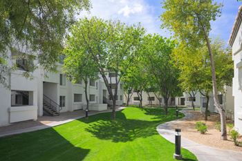 Lush landscaping with lawns throughout