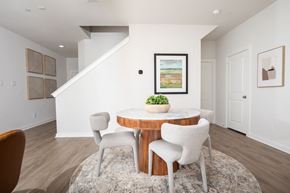 Pearland apartment for rent - A dining room with a round table and chairs.