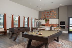 Porter apartment for rent - A pool table is in the middle of a room with a kitchen in the background.