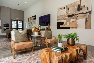 Porter apartment for rent - A living room with a wooden coffee table and a painting on the wall.