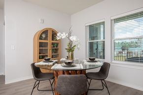 Porter apartment for rent - A dining room with a table set for two and a view of the outside.