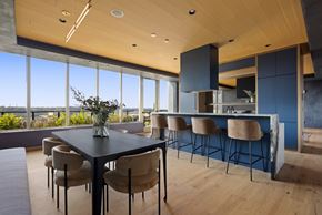 Washington apartment for rent - A modern dining room with a large table and chairs.