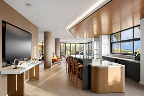 Washington apartment for rent - A modern kitchen with a large island and wooden cabinets.