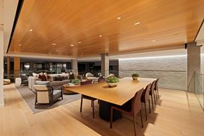 Washington apartment for rent - A modern dining room with a long wooden table and chairs.